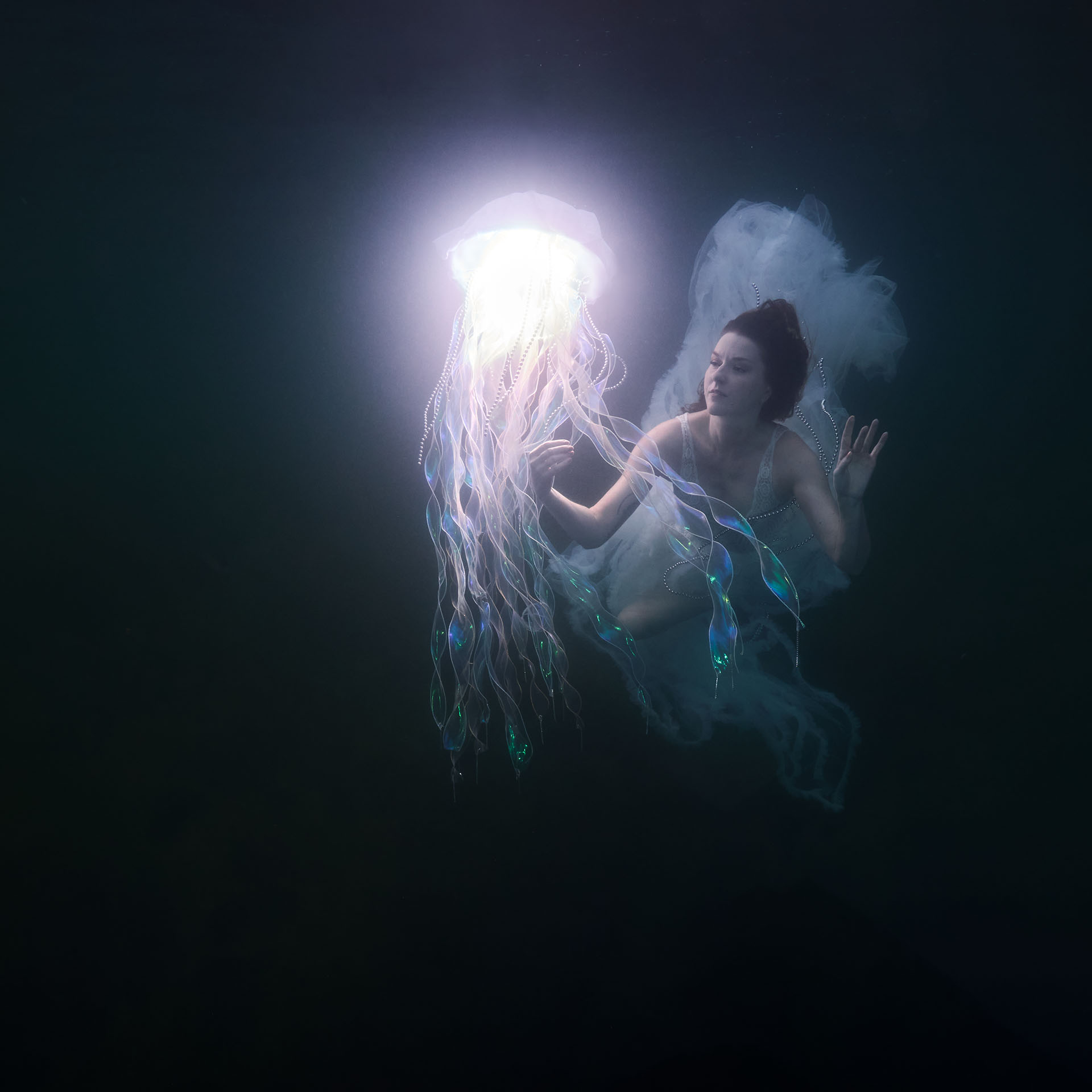 Open Water — a figure adrift in a dark lake beside a glowing LumiJelly, first Freiwasser deployment, TheLumiVerse by Stephan Ernst